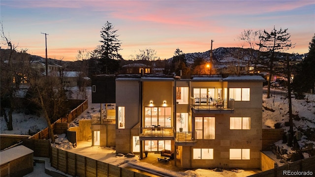 2206 Alpine Dr, Boulder, CO 80304 - back of house featuring a mountain view, fence, and a balcony