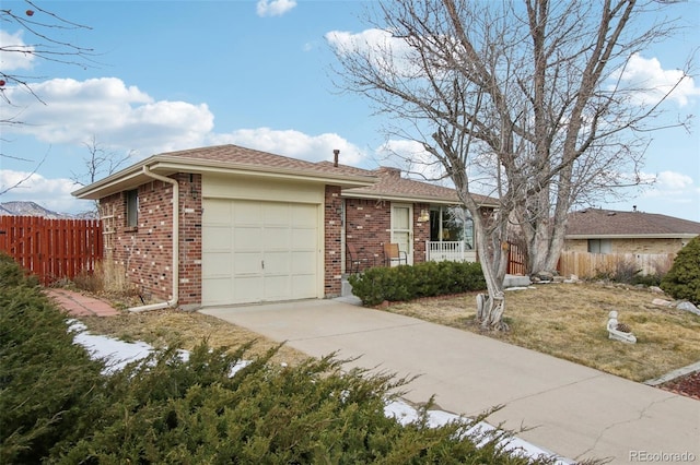 ranch-style home with a front yard and a garage