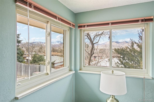 sunroom featuring a mountain view