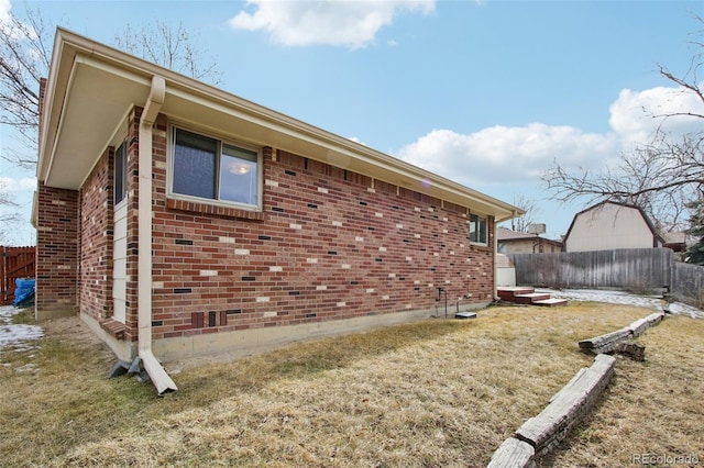 view of property exterior featuring a yard