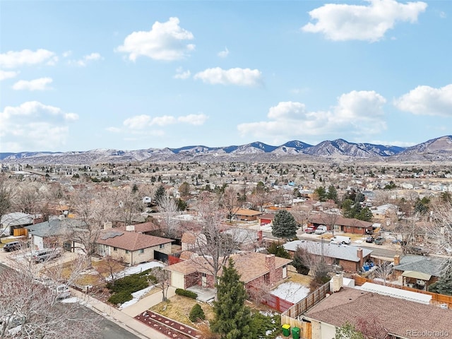 birds eye view of property with a mountain view