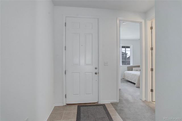 9643 Birch Ln, Thornton, CO 80229 - hall featuring baseboards and light tile patterned floors