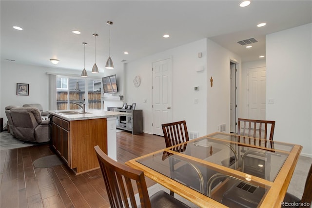 9643 Birch Ln, Thornton, CO 80229 - dining room featuring dark wood finished floors, recessed lighting, and baseboards