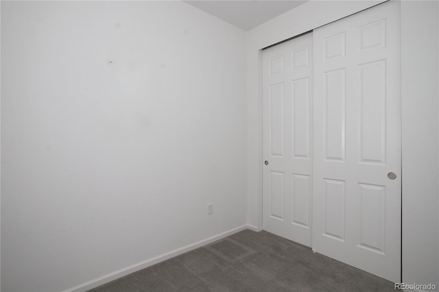 9643 Birch Ln, Thornton, CO 80229 - unfurnished bedroom with dark colored carpet, a closet, and baseboards
