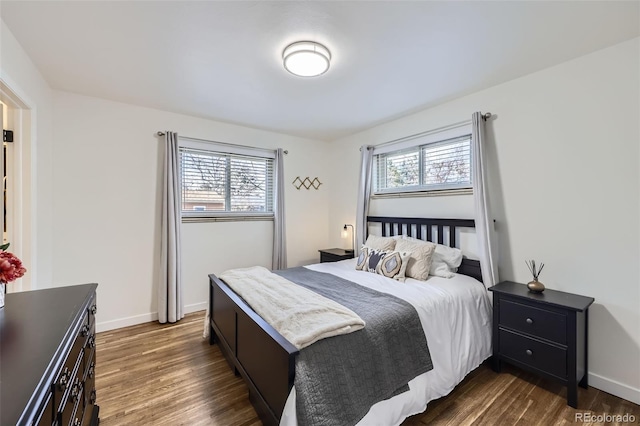 bedroom featuring dark hardwood / wood-style flooring