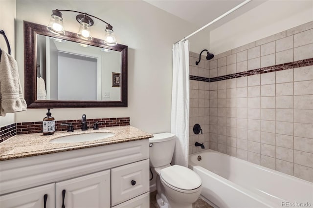 full bathroom with vanity, toilet, and shower / bath combo with shower curtain