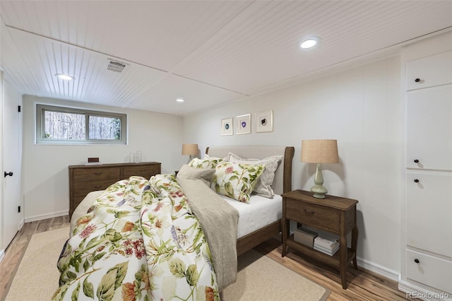 bedroom with light hardwood / wood-style floors