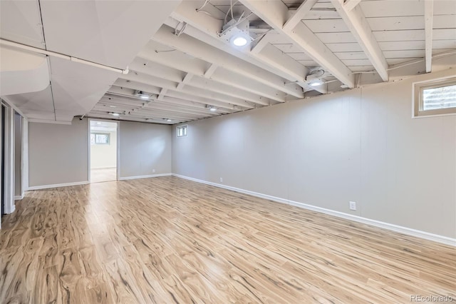 basement featuring light hardwood / wood-style floors