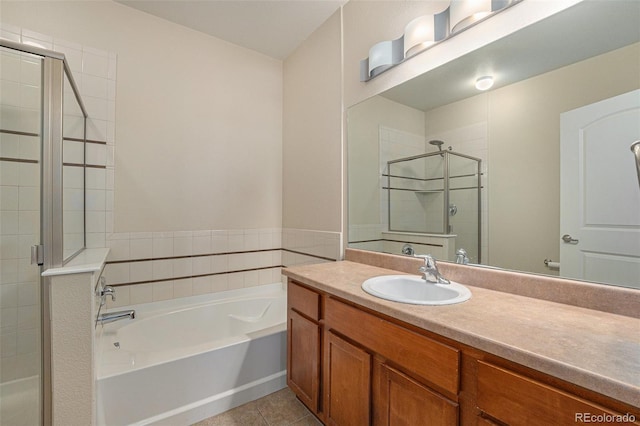 13456 Via Varra Unit 140, Broomfield, CO 80020 - full bath featuring a shower stall, a garden tub, vanity, and tile patterned flooring
