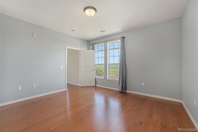 13456 Via Varra Unit 140, Broomfield, CO 80020 - unfurnished room featuring wood finished floors and baseboards