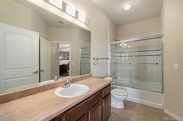 13456 Via Varra Unit 140, Broomfield, CO 80020 - bathroom with vanity, bath / shower combo with glass door, and tile patterned flooring