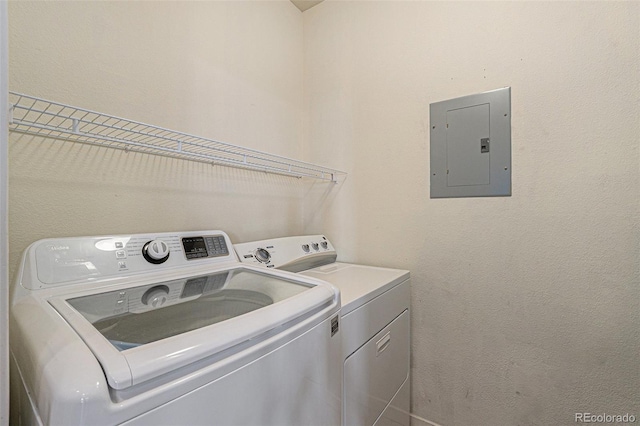 13456 Via Varra Unit 140, Broomfield, CO 80020 - washroom featuring electric panel and washing machine and clothes dryer