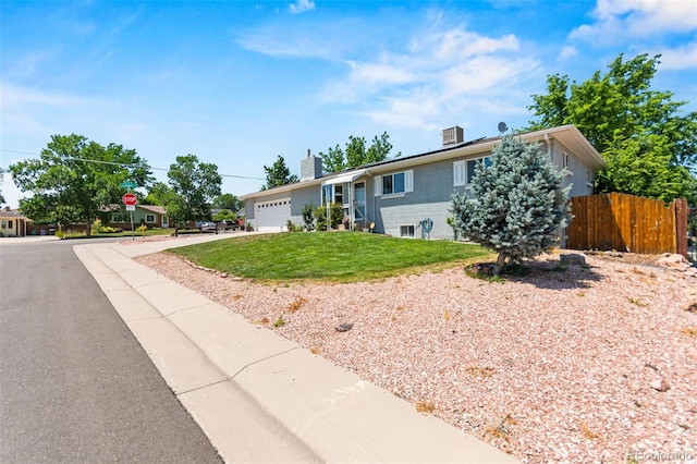 3397 W Tanforan Dr, Englewood, CO 80110 - ranch-style house featuring concrete driveway, a garage, and a chimney