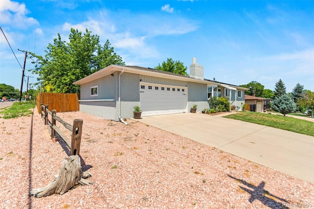 3397 W Tanforan Dr, Englewood, CO 80110 - ranch-style home with a garage, brick siding, concrete driveway, and a chimney