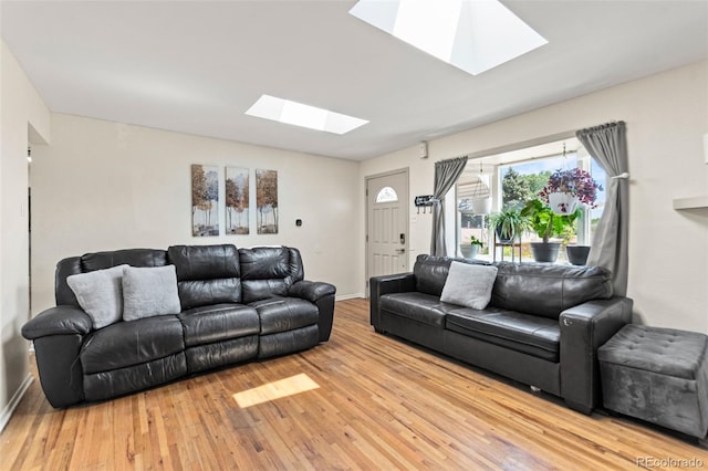 3397 W Tanforan Dr, Englewood, CO 80110 - living room featuring a skylight and light wood-style floors