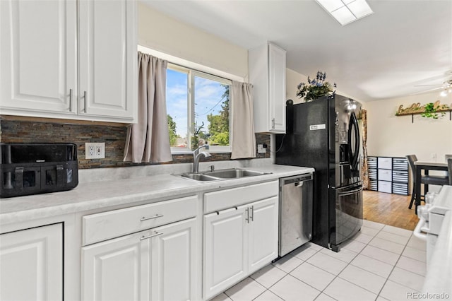 3397 W Tanforan Dr, Englewood, CO 80110 - kitchen featuring stainless steel dishwasher, white cabinets, and decorative backsplash