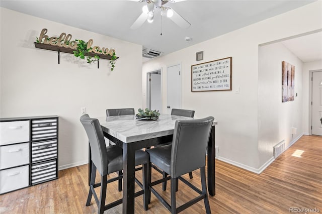 3397 W Tanforan Dr, Englewood, CO 80110 - dining space with light wood-type flooring and a ceiling fan