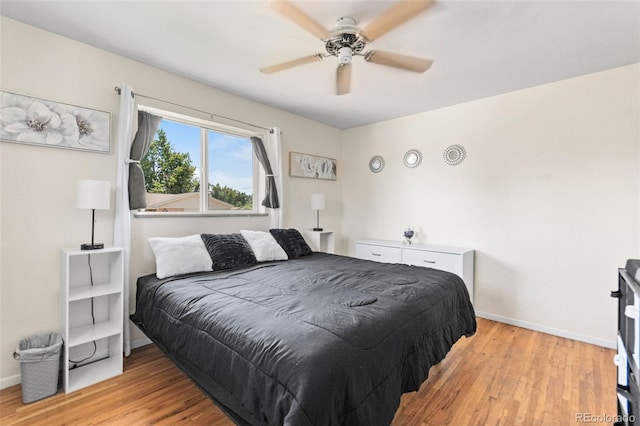 3397 W Tanforan Dr, Englewood, CO 80110 - bedroom with light wood finished floors and a ceiling fan