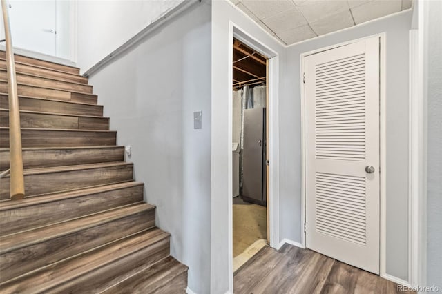 3397 W Tanforan Dr, Englewood, CO 80110 - stairway featuring wood finished floors and baseboards
