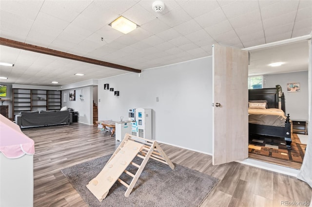 3397 W Tanforan Dr, Englewood, CO 80110 - recreation room with wood finished floors and baseboards