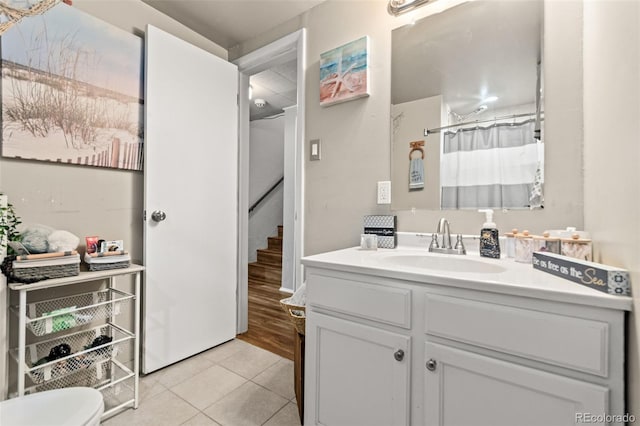 3397 W Tanforan Dr, Englewood, CO 80110 - full bath featuring tile patterned floors, vanity, and a shower with curtain