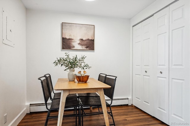 dining area featuring dark hardwood / wood-style floors and baseboard heating