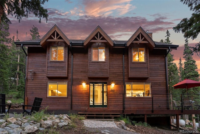 view of front facade with a wooden deck