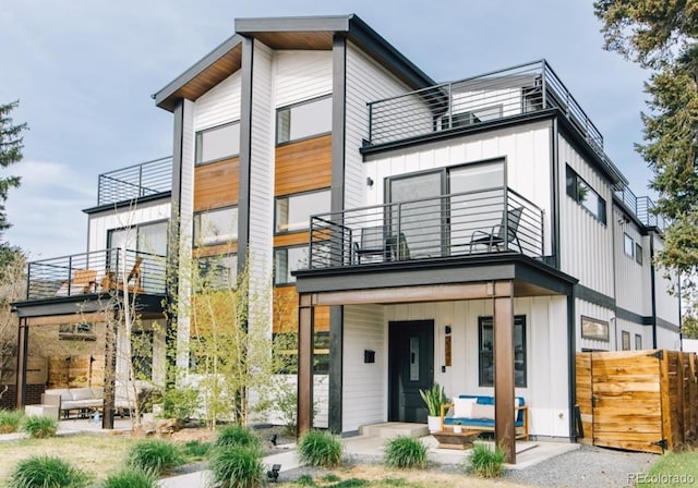 2147 S Sherman St, Denver, CO 80210 - contemporary home featuring a balcony and board and batten siding