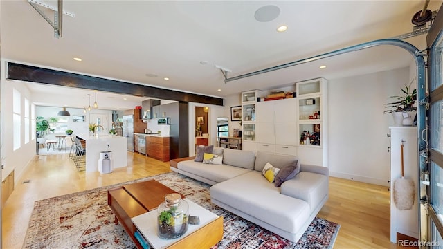 2147 S Sherman St, Denver, CO 80210 - living area featuring light wood-style flooring and recessed lighting