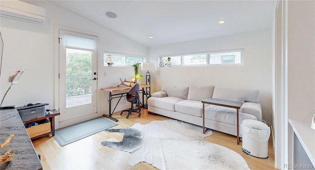 2147 S Sherman St, Denver, CO 80210 - living room featuring a wall unit AC, vaulted ceiling, a desk, and light wood finished floors