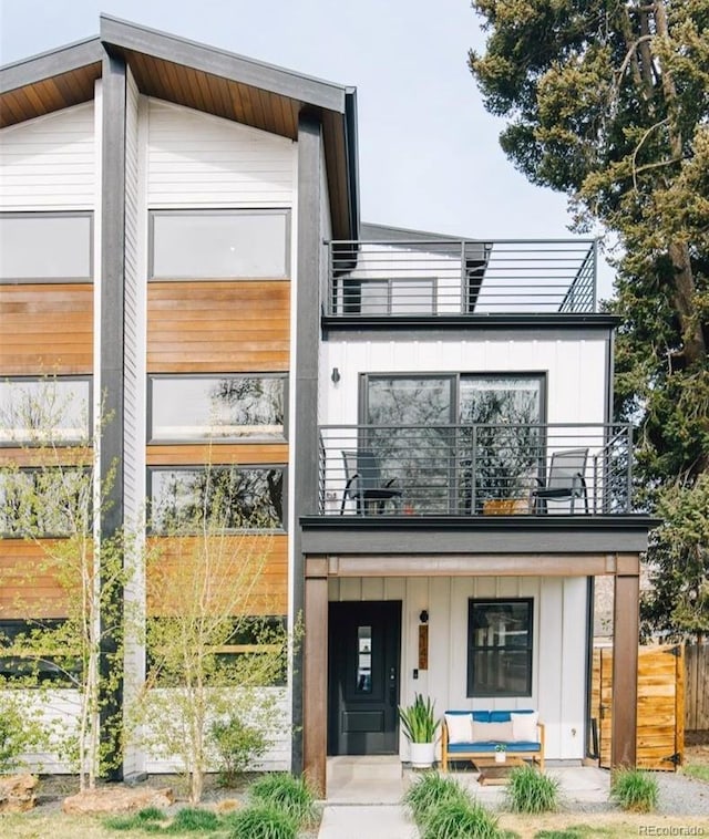 2147 S Sherman St, Denver, CO 80210 - contemporary house with a balcony, board and batten siding, and covered porch