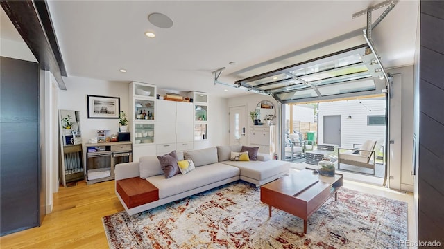 2147 S Sherman St, Denver, CO 80210 - living room featuring light wood-style floors, a garage, and recessed lighting