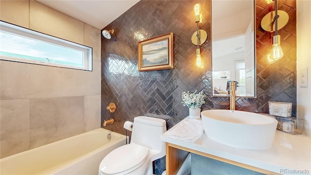2147 S Sherman St, Denver, CO 80210 - full bath featuring tile walls, vanity, and  shower combination