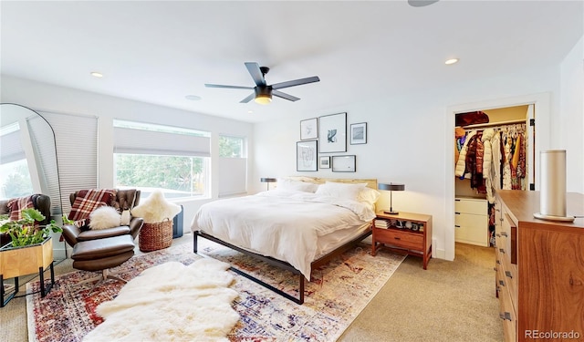 2147 S Sherman St, Denver, CO 80210 - bedroom with light colored carpet, a walk in closet, a ceiling fan, and recessed lighting