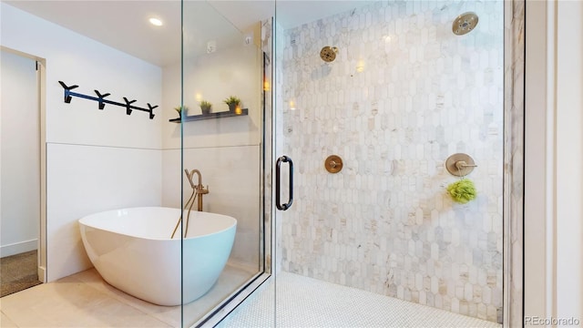 2147 S Sherman St, Denver, CO 80210 - bathroom with a stall shower, a soaking tub, and tile patterned floors