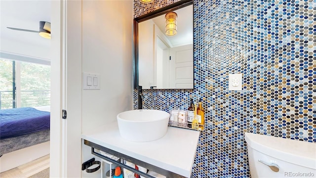 2147 S Sherman St, Denver, CO 80210 - ensuite bathroom featuring tasteful backsplash and vanity