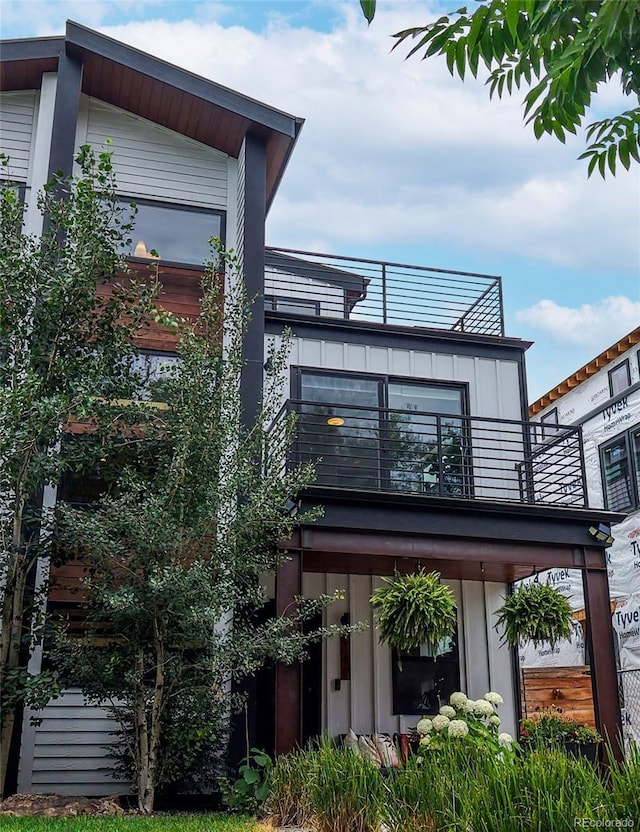 2147 S Sherman St, Denver, CO 80210 - back of property with a balcony and board and batten siding