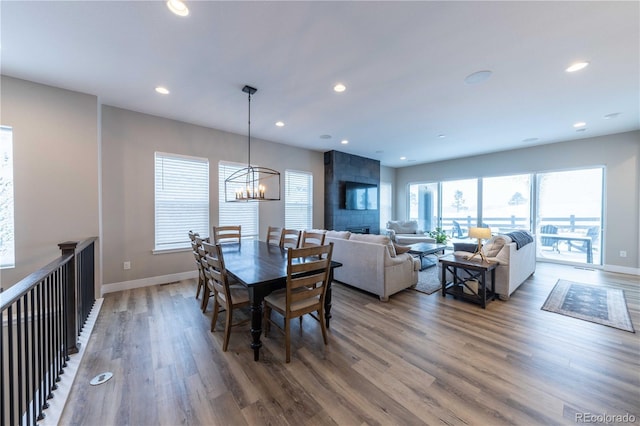 dining room with an inviting chandelier and hardwood / wood-style floors