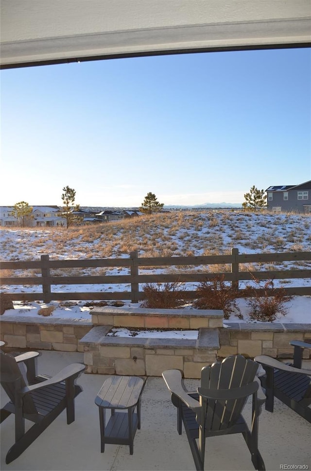 view of snow covered patio