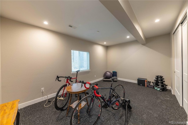 workout area featuring visible vents, baseboards, and recessed lighting