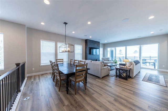 dining area with recessed lighting, baseboards, and wood finished floors