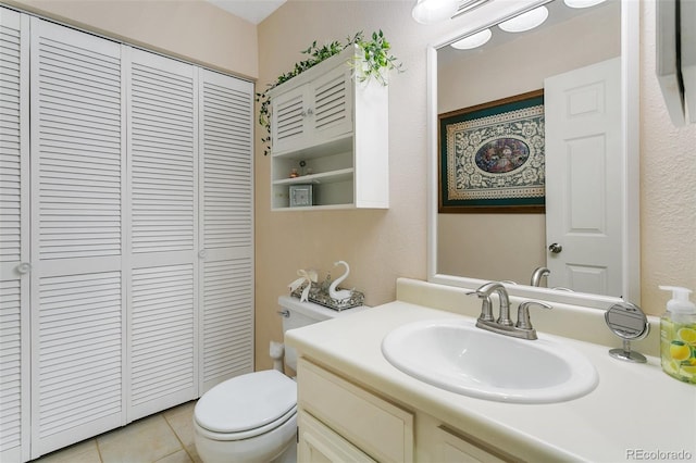 3338 Soaring Bird Cir, Colorado Springs, CO 80920 - bathroom featuring a closet, tile patterned floors, toilet, and vanity