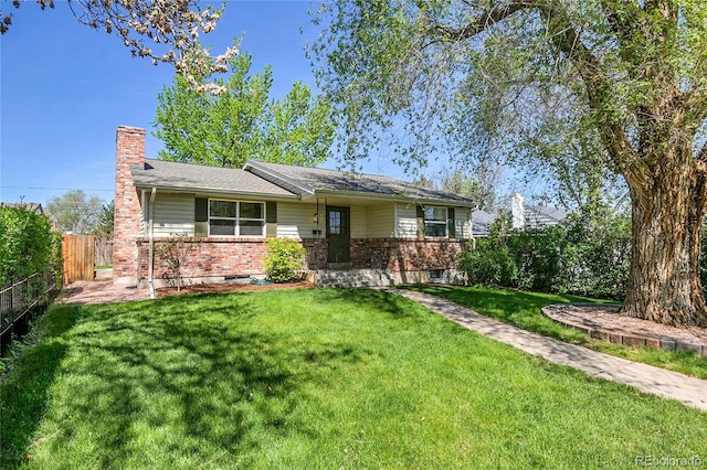 4781 S Grant St, Englewood, CO 80113 - view of front facade featuring a chimney and brick siding