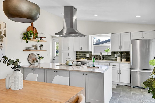 4781 S Grant St, Englewood, CO 80113 - kitchen featuring freestanding refrigerator, lofted ceiling, a sink, island exhaust hood, and open shelves