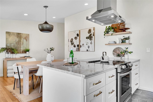 4781 S Grant St, Englewood, CO 80113 - kitchen featuring stainless steel range with electric stovetop, wall chimney range hood, light stone countertops, white cabinetry, and wood finished floors