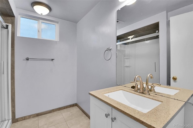 4781 S Grant St, Englewood, CO 80113 - full bath with baseboards, a shower stall, vanity, and tile patterned floors