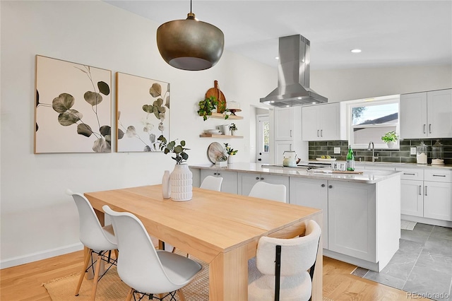 4781 S Grant St, Englewood, CO 80113 - dining space featuring healthy amount of natural light, baseboards, recessed lighting, and light wood-style floors