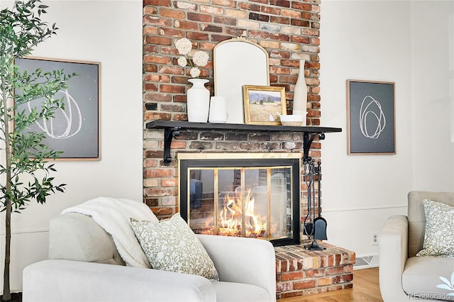 4781 S Grant St, Englewood, CO 80113 - living room featuring a brick fireplace and wood finished floors