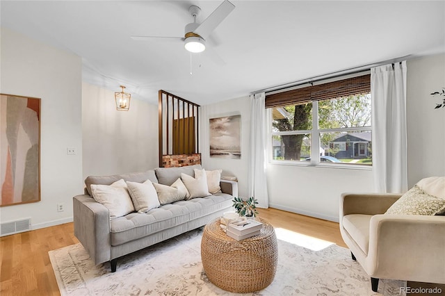 4781 S Grant St, Englewood, CO 80113 - living room featuring wood finished floors, a ceiling fan, and baseboards