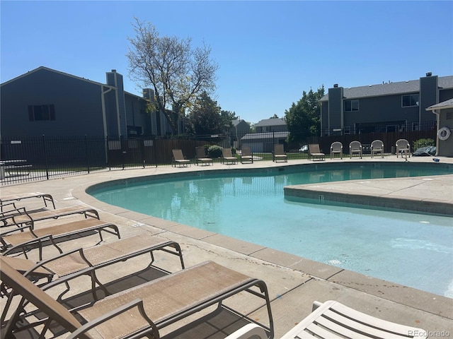 8771 Carr Loop, Arvada, CO 80005 - community pool with a patio area and a residential view